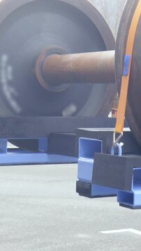 Forklift loads cargo pallet with wheelbase on trailer