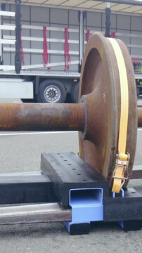 Forklift forks set into pallet with wheelbase long shot slow motion