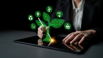 Digital Innovation in Sustainable Development with Green Technology Symbols and Hands Engaging on a Tablet Device for Eco-Friendly Solutions Quark. © InfiniteFlow