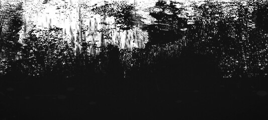 Abstract monochrome glitch background with distressed textured horizontal lines and dark noisy grainy elements, artistic grainy overlay with copy space. © Nusrat