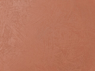 Fototapeta premium Terracotta stucco background with swirl brush marks and organic pattern