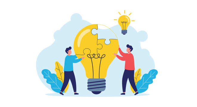 Collaborating team of two people fitting together pieces of a large lightbulb jigsaw puzzle to find a creative solution and new ideas.