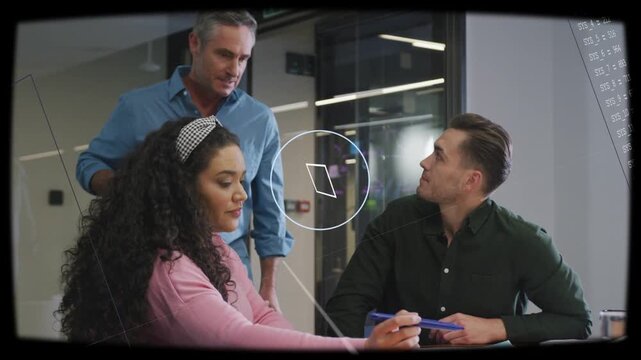Standing man ending call leaning over table as tech team reviewing papers, radar HUD over table