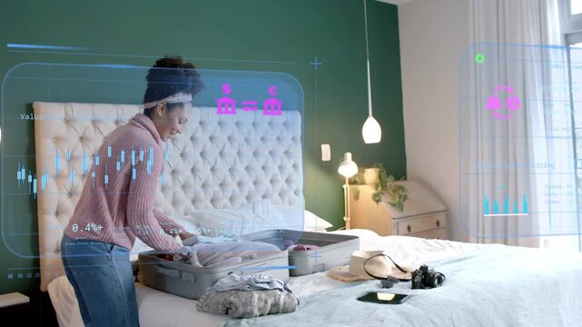 Woman placing clothes into grey suitcase thereby activating responsive AR gauges for travel packing