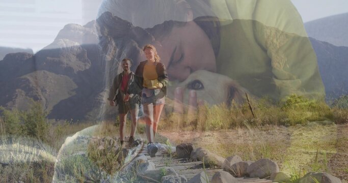 Pressing owner cuddling light-colored dog in bedroom over rocky trail, with packs hiking boots