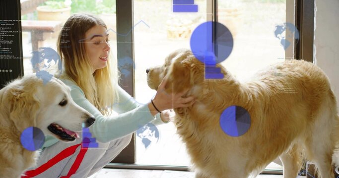 Crouching woman in blue top and grey sweats petting two golden dogs near glass-door, blue overlays