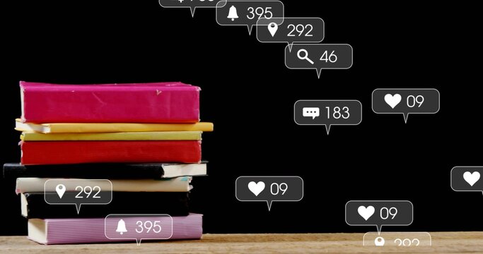 Displaying bright hardbacks left on table with black backdrop and rising notifications, copy space