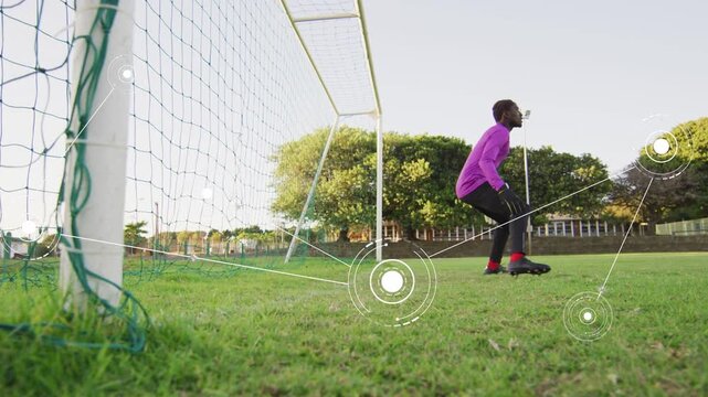 Sports goalkeeper stepping toward incoming shot, jumping and catching ball with HUD tracking feet