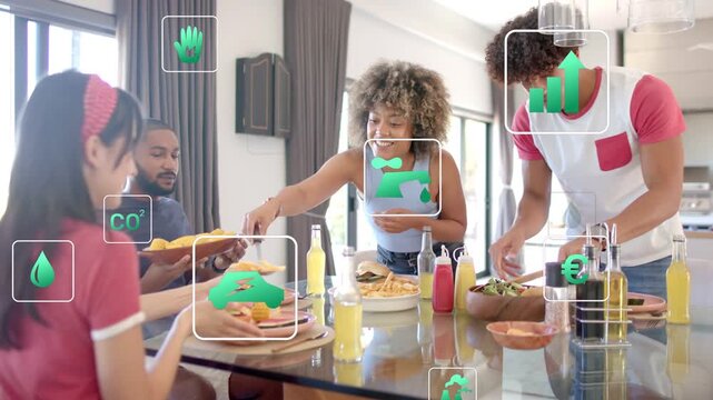 Woman scooping food, group sharing meal at dining table, green icons appearing showing eco metrics