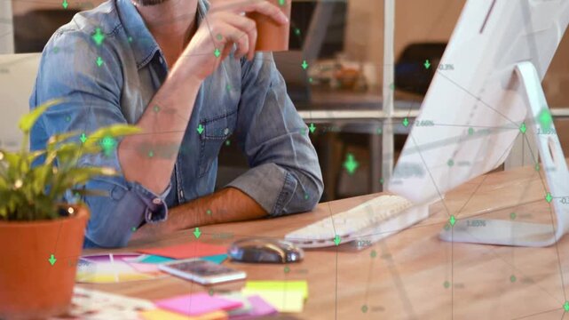 Man pausing then reaching for coffee while green data analytics overlays guiding his screen review