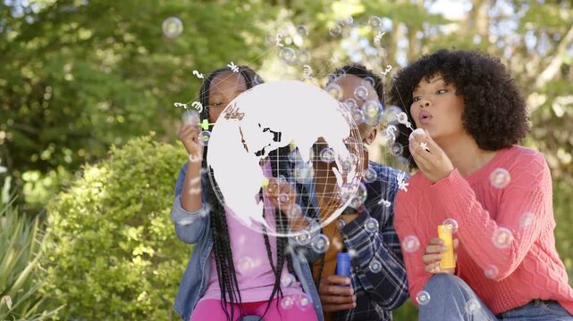 Child lifting wand blowing bubbles, parents sitting creating ads, globe overlay centered rotating