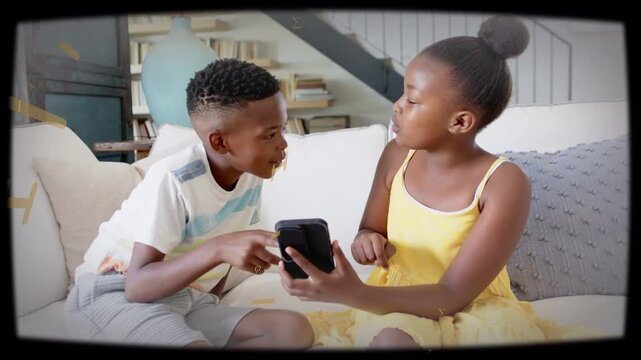 Siblings sharing phone on couch gold overlay fading revealing screen boy tapping for education