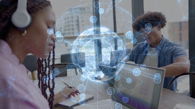 Woman writing and man reaching laptop, starting globe growing and showing tech network aiding work