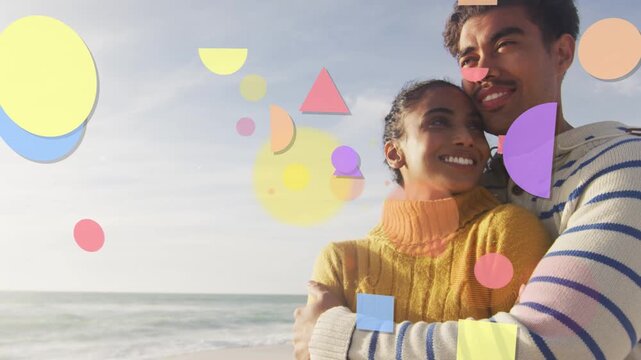 Couple holding on shore gazing out, shapes entering left passing around, forming promo overlay