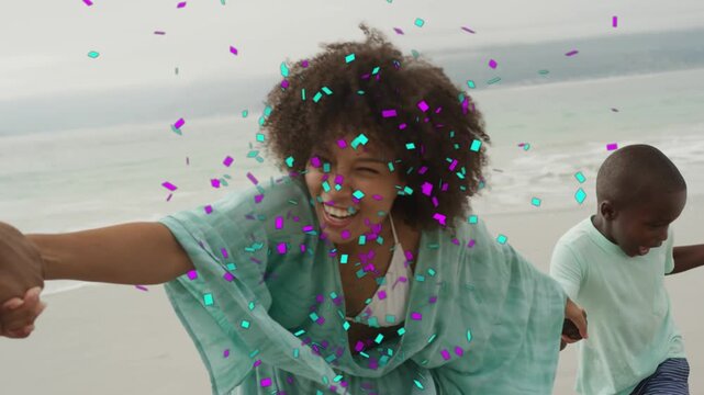 Pair holding hands sparking run woman leading kids along shore confetti showering group for ads