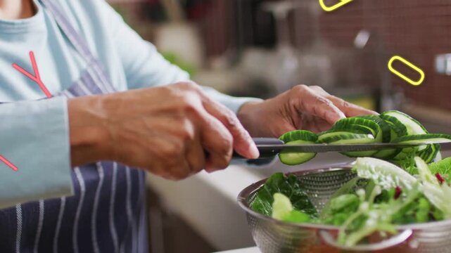 Graphic letters fading as woman slicing cucumber, funneling rounds into colander for cooking demo