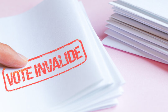 Invalid vote stamp in French marked on an election document, concept of vote invalidation