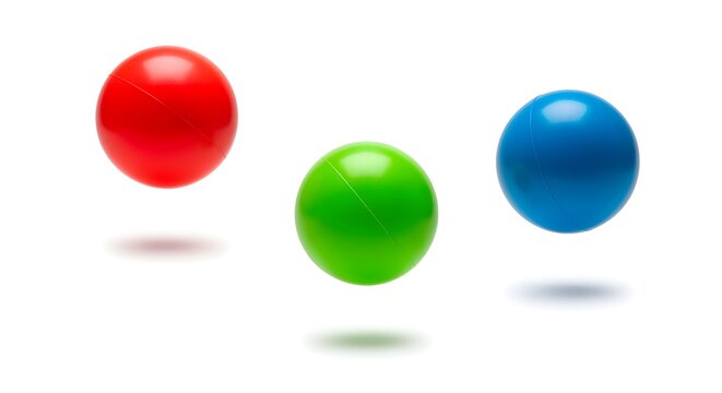 Colorful juggling balls frozen in mid-air, isolated on white.