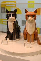 Fototapeta premium Cat figurines made from Lego bricks. Toy plastic cats.