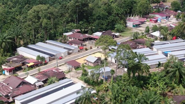 Agam, Indonesia - April 3rd 2026: Aerial Drone Push-in View of Temporary Housing Shelters for Flash Flood Victims in Salareh Aia: Detailed Look at Post-Disaster Resettlement and Humanitarian Relief