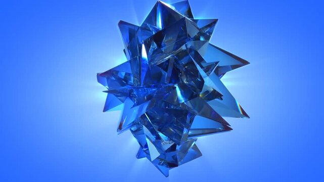 Slow motion spin of faceted crystalline sculpture rotating against blue gradient studio background from static viewpoint showing glossy reflective polyhedron
