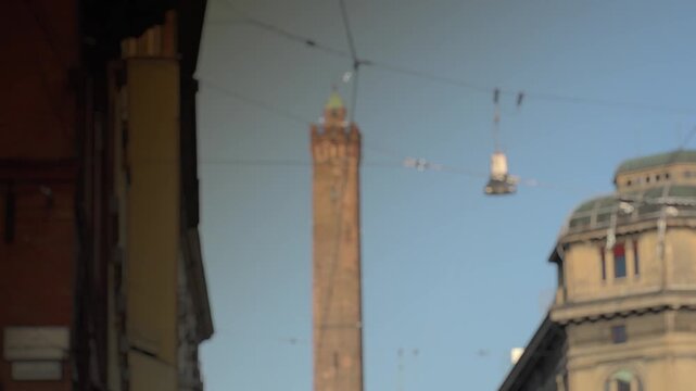 Busy boulevard at sunset in Bologna, Italy
