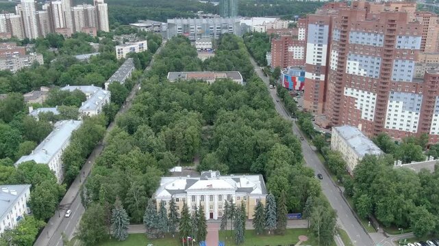 Drone orbiting city square with park in Khimki