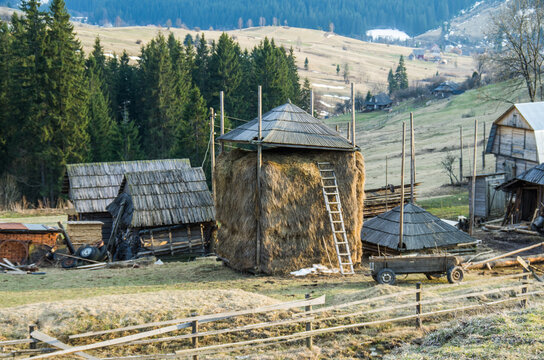 Haystack and Wooden Farm Buildings in Mountain Village