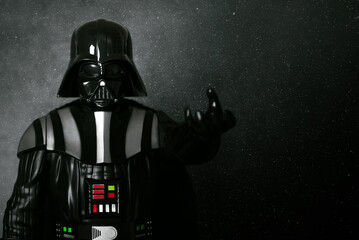 Naklejka premium Darth Vader action figure character from the Star Wars movie saga and space for text. Illustrative editorial
