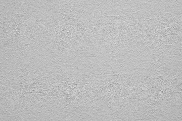Obraz premium White gray wall with a rough grain texture. wall is covered in white paint. wall is not very smooth as white textured background web banner template page