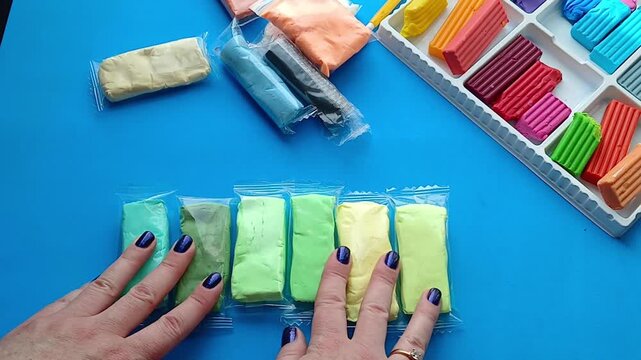 Hands are sorting plasticine - preparation for the creative process