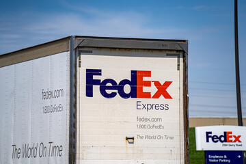 Naklejka premium Rear view of FedEx Freight truck driving on road in Toronto. Toronto, Canada - April 23, 2026.