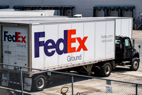 View of FedEx Ground delivery truck at warehouse loading docks. Toronto, Canada - April 23, 2026.