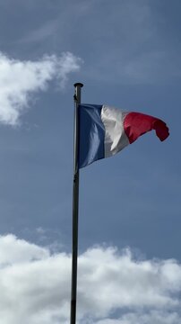 French flag waving on pole