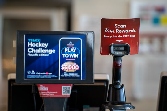 Close up of Tim Hortons cash register and Tims Rewards scanner device. Toronto, Canada - April 23, 2026.