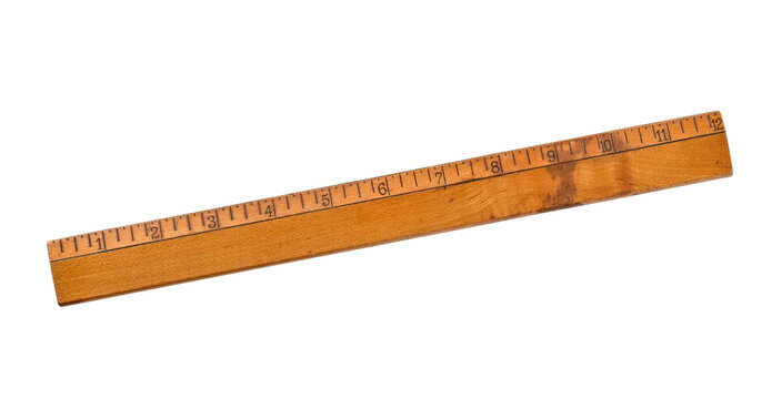 An aged wooden ruler with inch markings, showing signs of wear and patina. Classic measuring tool isolated on a transparent background with a nostalgic, vintage feel