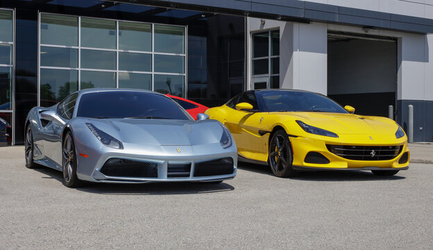 Preowned Ferrari 488 GTB and Ferrari Portofino M display at a dealership. With price concerns, used cars are in high demand.