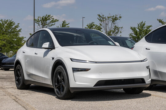 Tesla Model Y Electric Midsize SUV at a dealership. Tesla offers the Model Y with up to 321 miles driving range. MY:2026