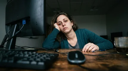 A visual echo of digital burnout, where the flickering screen reflects a hollowed-out spirit. It captures the heavy, stagnant air of a task that has no end and a mind that has reached its limit. © Everlasting Dreams