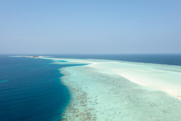 Fototapeta premium Turquoise Maldives atoll with white sandbank from aerial perspective