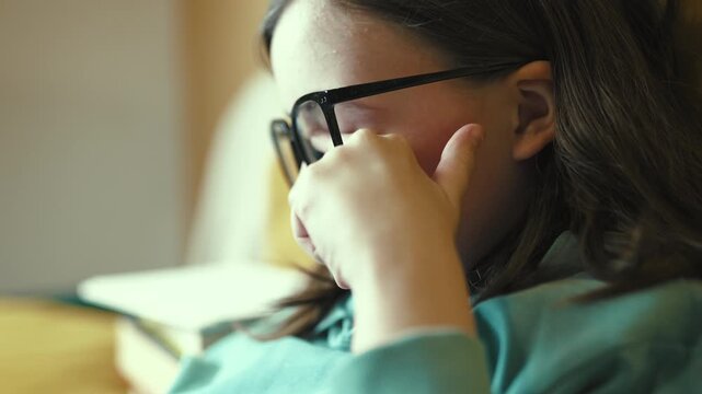 Tired Little Girl Touching Her Exhausted Eyes Under Glasses, Child Rubbing Eyes from Fatigue, 4K 10-bit
