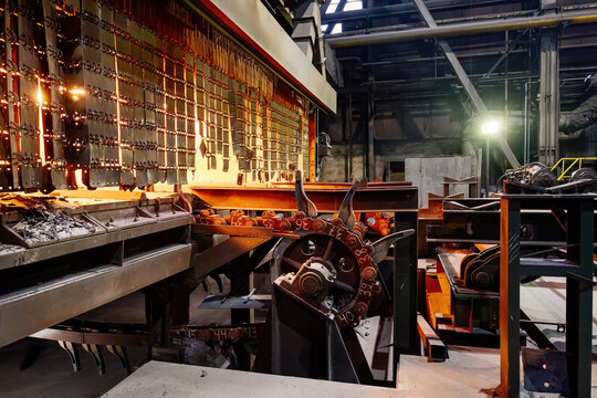Rolled metal factory. Roller conveyor of metal rolling mill