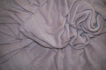 Soft Crumpled Plush Blanket Background, Mauve Fleece Fabric Texture with Natural Folds, Cozy Hygge Home Decor Textile, Warm Fuzzy Bedding Background for Wellness and Lifestyle Design © stefanbalaz