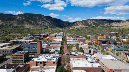 Boulder colorado pearl street mall on a clear day with trees and mountains  © Obsidia Media