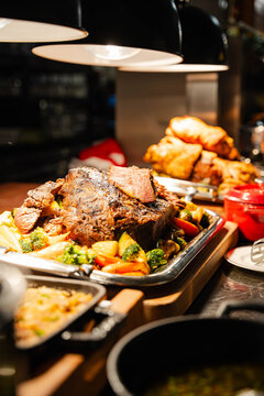 close-up view of a professional carvery station at an upscale buffet
