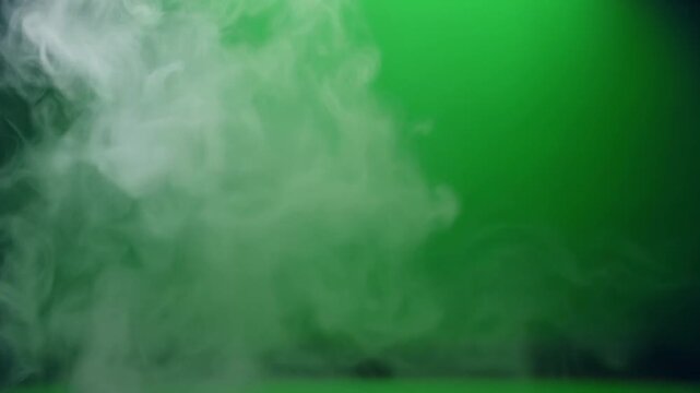 Green smoke rising in air.