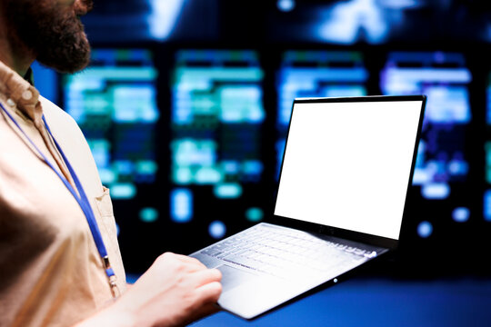 African american supervisor monitoring cryptocurrency mining supercomputers solving complex mathematical equations. Expert admin in server hub hosting blockchain technology high volume transactions