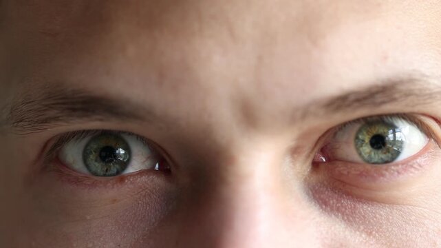 Macro view of young man with beautiful eyes