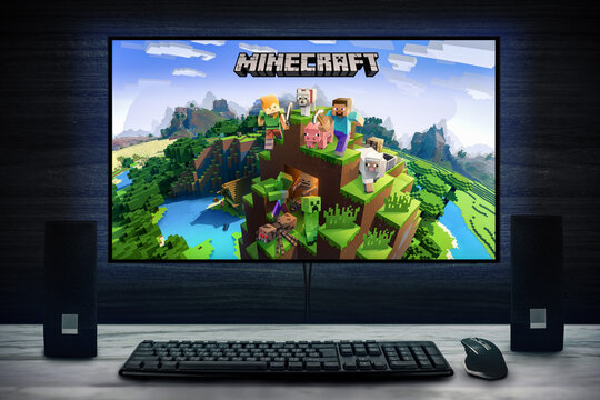 Cali, Colombia - September 27, 2022: Minecraft video game logo on PC screen with keyboard, mouse and speakers.