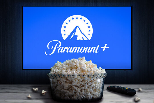 Cali, Colombia - June 12 2022: Television screen displaying Paramount+ logo with a bowl of popcorn and a remote control in the foreground.